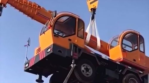 科技探秘 百?lài)嵐こ虣C(jī)械高空懸掛，吊車(chē)起重能力顯神威